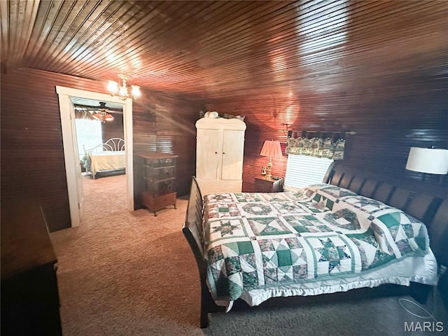 carpeted bedroom featuring wooden ceiling and a chandelier