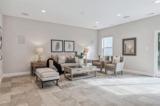 973 Tara Ct, Chesterfield, MO 63005 - living area with plenty of natural light, recessed lighting, and light stone finish floors