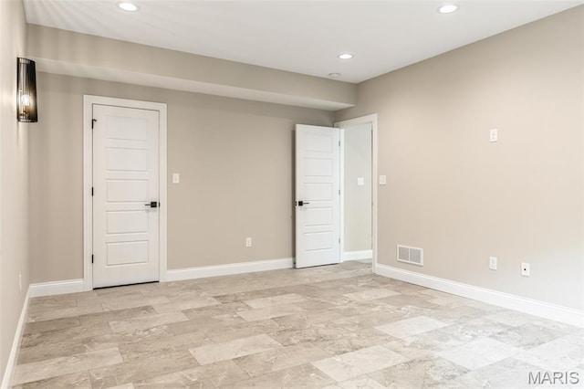 973 Tara Ct, Chesterfield, MO 63005 - empty room with recessed lighting and light stone finish flooring