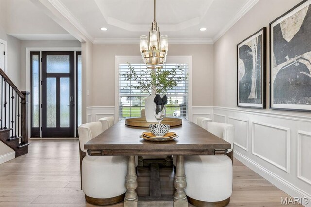 973 Tara Ct, Chesterfield, MO 63005 - dining area with a chandelier, stairway, a tray ceiling, a decorative wall, and a wainscoted wall