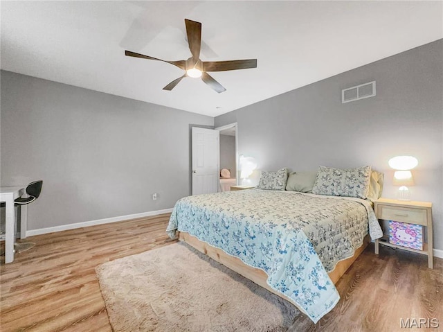 3242 Camp St, Saint Charles, MO 63301 - bedroom with wood finished floors, baseboards, and ceiling fan