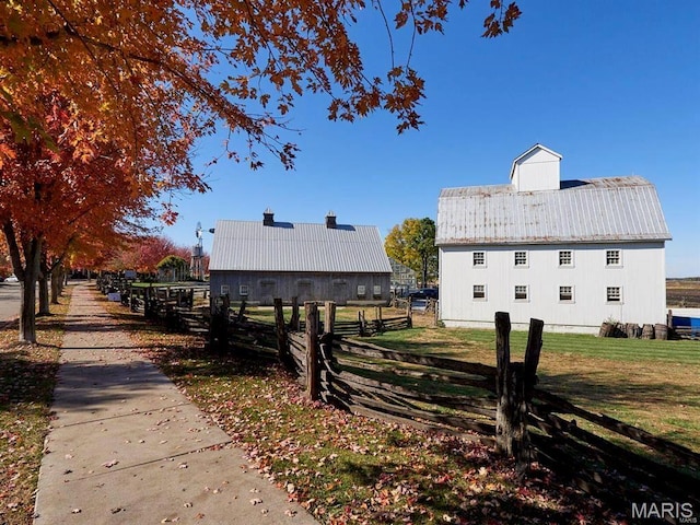 3242 Camp St, Saint Charles, MO 63301 - view of property exterior with an outdoor structure and a barn