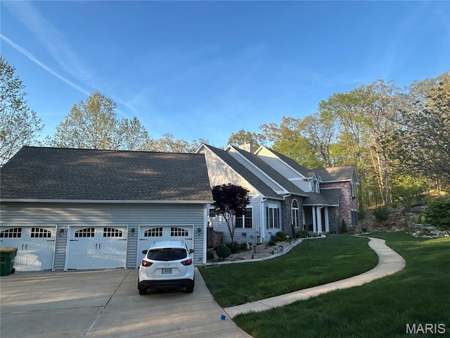 517 Old Logging Rd, Eureka, MO 63025 - view of front facade with driveway, a front lawn, and an attached garage