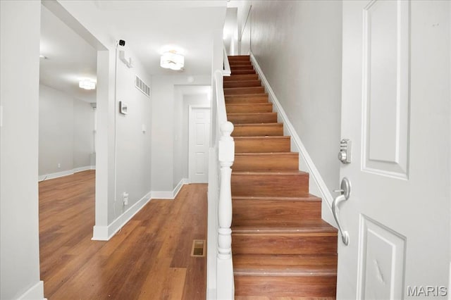 3431 California Ave, Saint Louis, MO 63118 - stairs featuring wood finished floors and baseboards