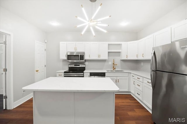 3431 California Ave, Saint Louis, MO 63118 - kitchen with stainless steel appliances, a sink, open shelves, and white cabinets