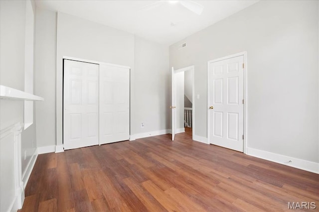 3431 California Ave, Saint Louis, MO 63118 - unfurnished bedroom with wood finished floors, baseboards, and a closet