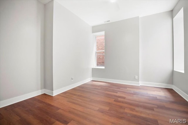 3431 California Ave, Saint Louis, MO 63118 - unfurnished room with wood finished floors, baseboards, and plenty of natural light