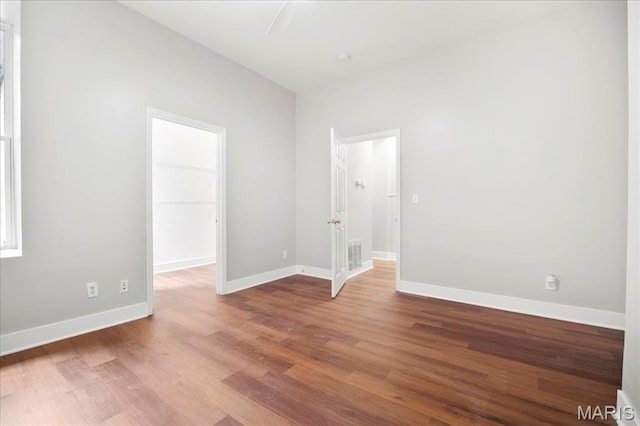 3431 California Ave, Saint Louis, MO 63118 - unfurnished room featuring wood finished floors and baseboards