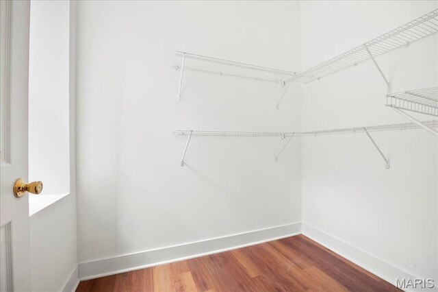 3431 California Ave, Saint Louis, MO 63118 - walk in closet with wood finished floors