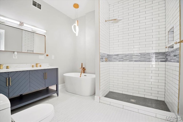 3431 California Ave, Saint Louis, MO 63118 - bathroom featuring a shower stall, vanity, a soaking tub, toilet, and baseboards
