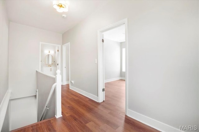 3431 California Ave, Saint Louis, MO 63118 - hall with an upstairs landing, wood finished floors, and baseboards