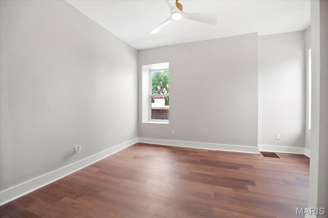 3431 California Ave, Saint Louis, MO 63118 - spare room featuring baseboards, wood finished floors, and a ceiling fan