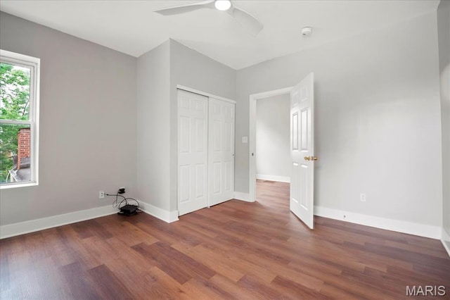 3431 California Ave, Saint Louis, MO 63118 - unfurnished bedroom featuring wood finished floors, a closet, baseboards, and ceiling fan