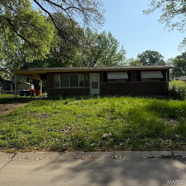 9732 Glen Owen Dr, Saint Louis, MO 63136 - view of front facade with brick siding and a carport