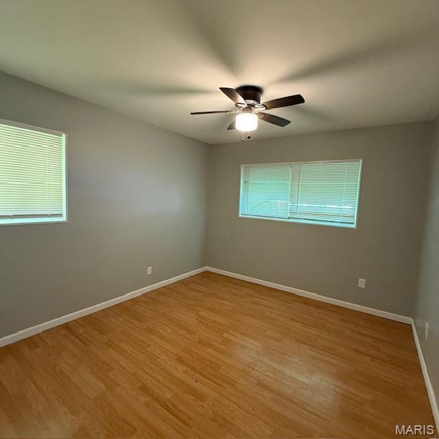9732 Glen Owen Dr, Saint Louis, MO 63136 - spare room with ceiling fan, light wood-type flooring, and baseboards