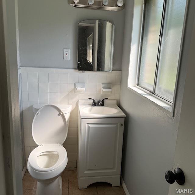 9732 Glen Owen Dr, Saint Louis, MO 63136 - bathroom featuring tile patterned flooring, vanity, toilet, and tile walls