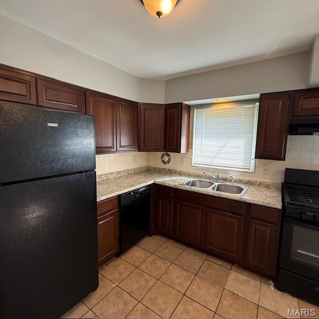 9732 Glen Owen Dr, Saint Louis, MO 63136 - kitchen with black appliances, a sink, light countertops, and light tile patterned floors