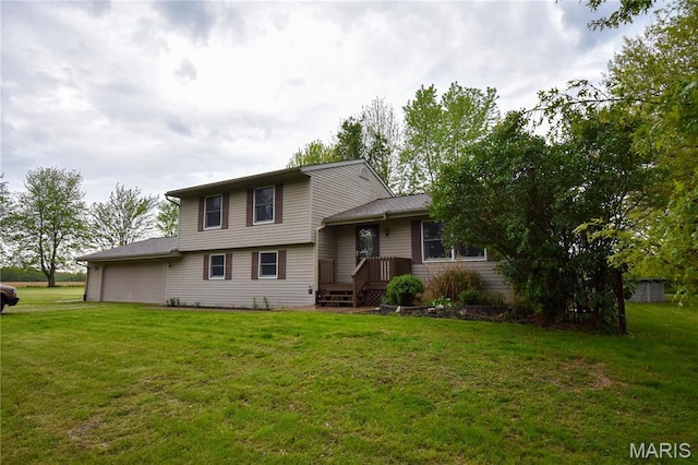 split level home featuring an attached garage and a front lawn