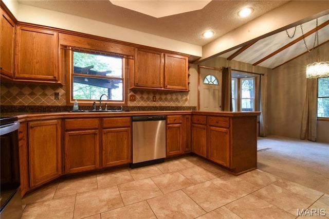 kitchen with stainless steel dishwasher, a sink, dark countertops, and brown cabinetry