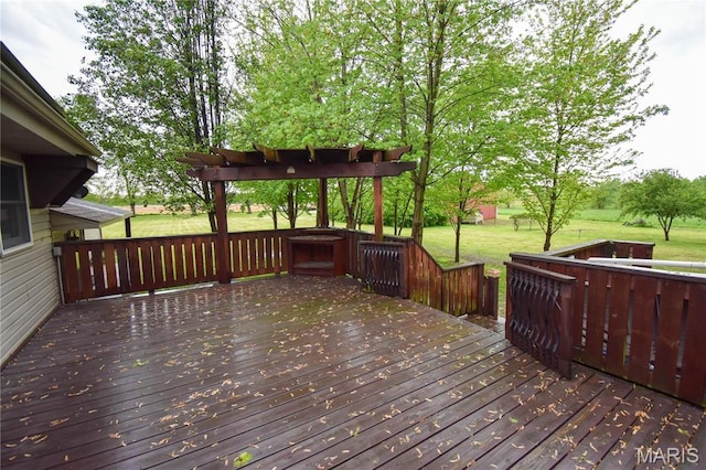 wooden terrace featuring a yard
