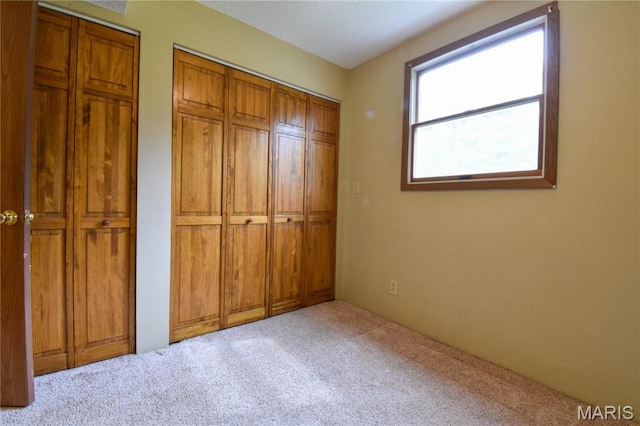 unfurnished bedroom with carpet floors