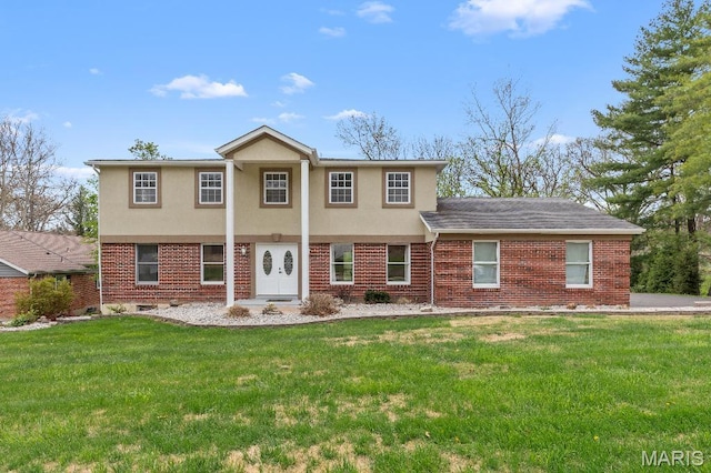 625 Pinebrook Dr, Town And Country, MO 63017 - view of front facade with a front lawn, stucco siding, and brick siding