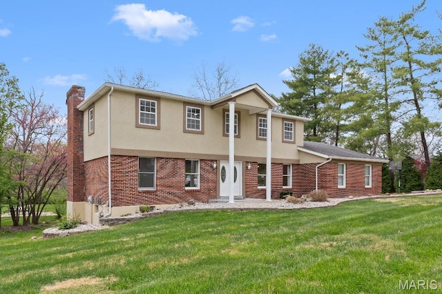 625 Pinebrook Dr, Town And Country, MO 63017 - view of front of house with a front yard, a chimney, and brick siding
