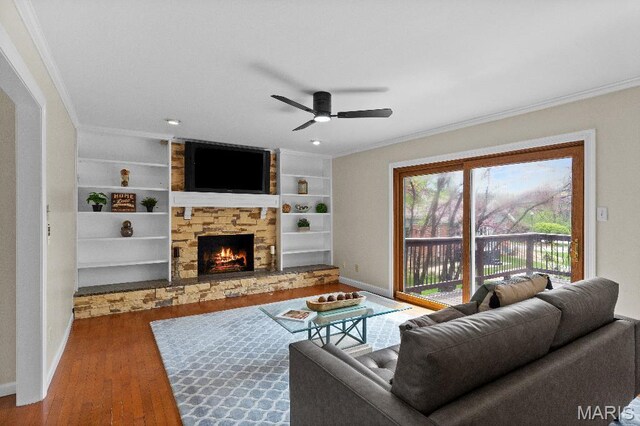 625 Pinebrook Dr, Town And Country, MO 63017 - living area with crown molding, wood finished floors, baseboards, a ceiling fan, and a fireplace