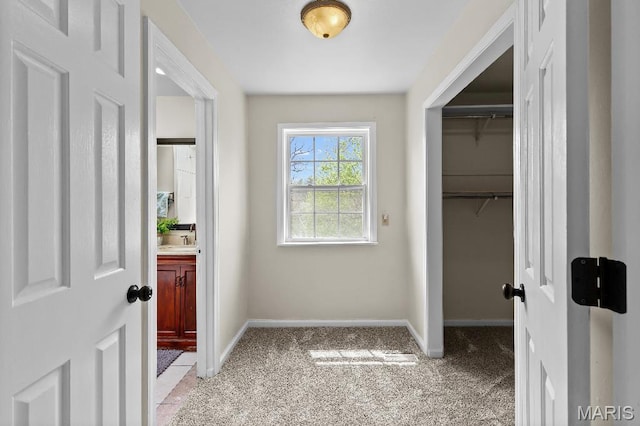 625 Pinebrook Dr, Town And Country, MO 63017 - doorway featuring light colored carpet, baseboards, and a sink