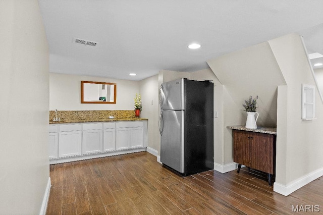 625 Pinebrook Dr, Town And Country, MO 63017 - kitchen featuring freestanding refrigerator, white cabinets, stone counters, dark wood-style flooring, and baseboards