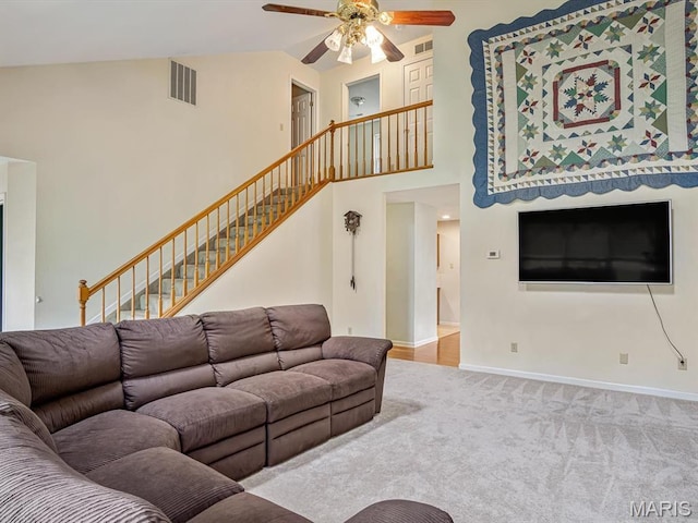 109 Miller Ct, Valmeyer, IL 62295 - carpeted living room with ceiling fan, stairway, baseboards, and high vaulted ceiling