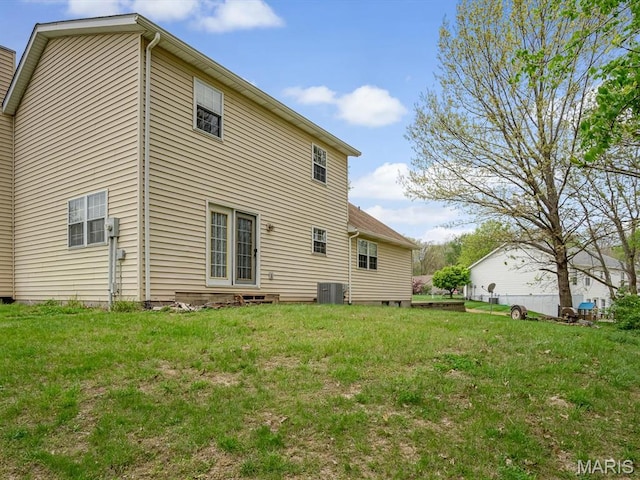 109 Miller Ct, Valmeyer, IL 62295 - rear view of house with central AC and a lawn