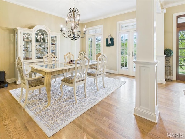 262 Woodland Hill Rd, Poplar Bluff, MO 63901 - dining space with french doors, light wood-style floors, ornamental molding, a chandelier, and baseboards
