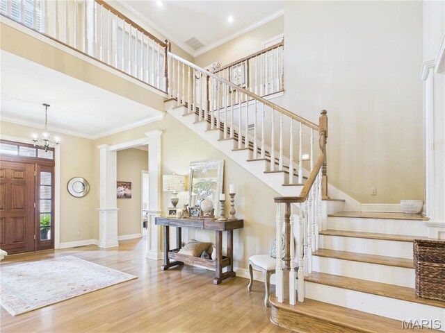 262 Woodland Hill Rd, Poplar Bluff, MO 63901 - foyer with wood finished floors, ornamental molding, stairway, baseboards, and a towering ceiling