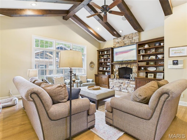 262 Woodland Hill Rd, Poplar Bluff, MO 63901 - living area with light wood-style flooring, beamed ceiling, a ceiling fan, a fireplace, and high vaulted ceiling