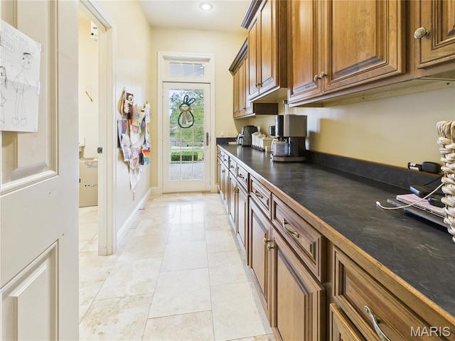 262 Woodland Hill Rd, Poplar Bluff, MO 63901 - kitchen with dark countertops, brown cabinetry, light tile patterned flooring, and recessed lighting