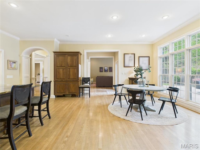 262 Woodland Hill Rd, Poplar Bluff, MO 63901 - dining area featuring arched walkways, light wood-style flooring, ornamental molding, recessed lighting, and baseboards