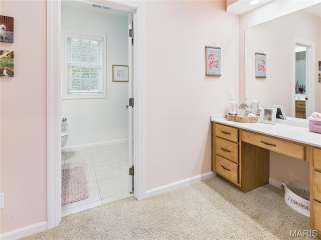 262 Woodland Hill Rd, Poplar Bluff, MO 63901 - bathroom featuring vanity, toilet, baseboards, and carpet floors