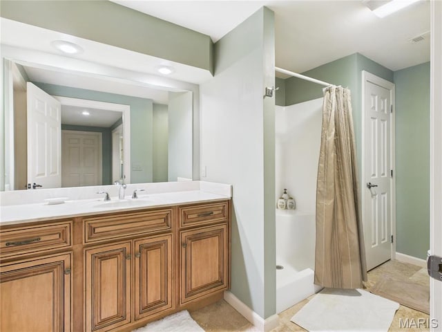 262 Woodland Hill Rd, Poplar Bluff, MO 63901 - bathroom with a shower stall, vanity, and baseboards