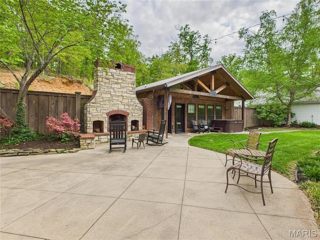 262 Woodland Hill Rd, Poplar Bluff, MO 63901 - view of patio featuring a hot tub and an outdoor stone fireplace