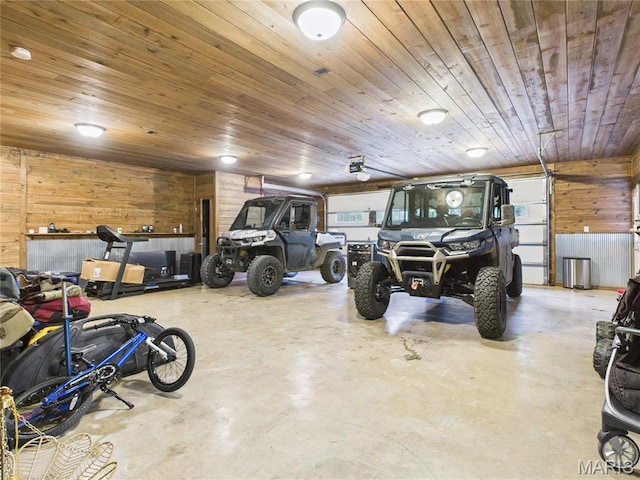 262 Woodland Hill Rd, Poplar Bluff, MO 63901 - garage with wooden walls, wood ceiling, and a garage door opener