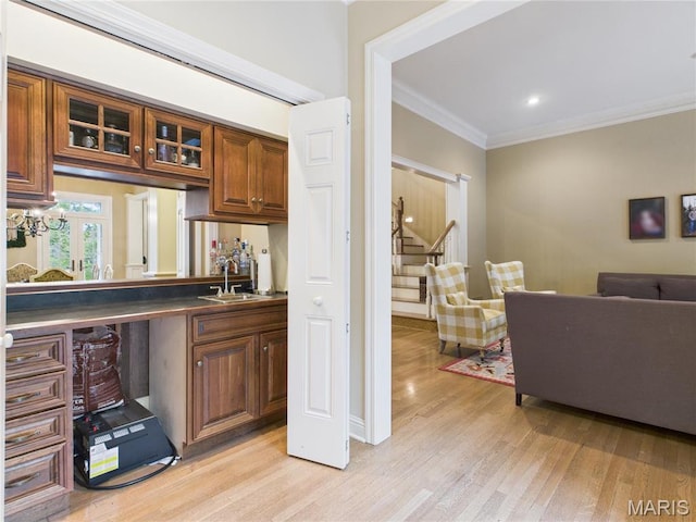 262 Woodland Hill Rd, Poplar Bluff, MO 63901 - bar area featuring a sink, stairs, light wood finished floors, ornamental molding, and recessed lighting