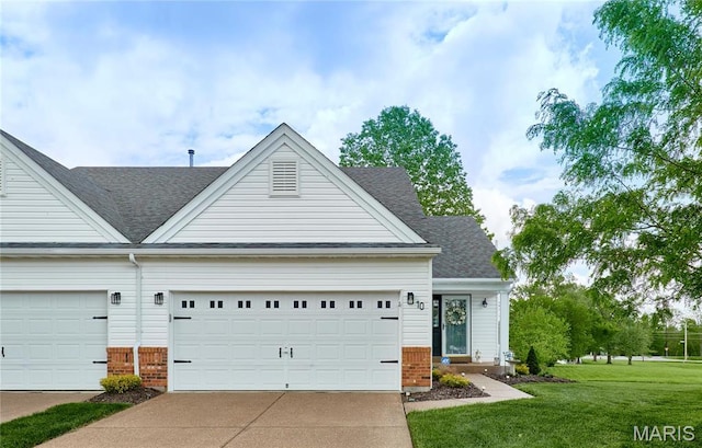 10 Warshire Ct Unit 67B, Ofallon, MO 63366 - traditional home with driveway, a front yard, a garage, and a shingled roof