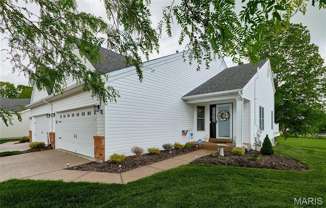 10 Warshire Ct Unit 67B, Ofallon, MO 63366 - view of front of house with a front lawn, a shingled roof, concrete driveway, and a garage