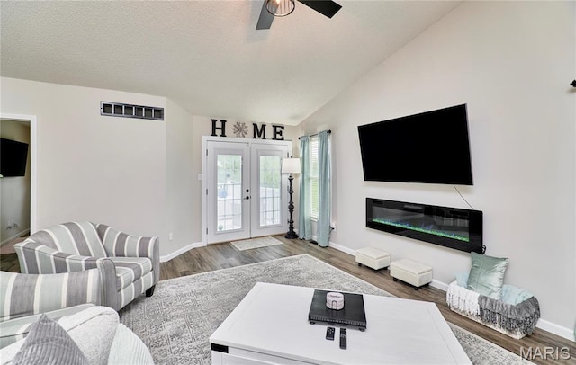 10 Warshire Ct Unit 67B, Ofallon, MO 63366 - living room with ceiling fan, wood finished floors, lofted ceiling, baseboards, and french doors