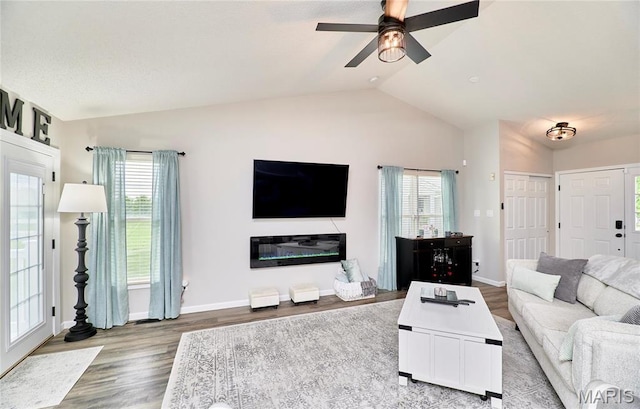 10 Warshire Ct Unit 67B, Ofallon, MO 63366 - living area featuring vaulted ceiling, wood finished floors, plenty of natural light, ceiling fan, and baseboards