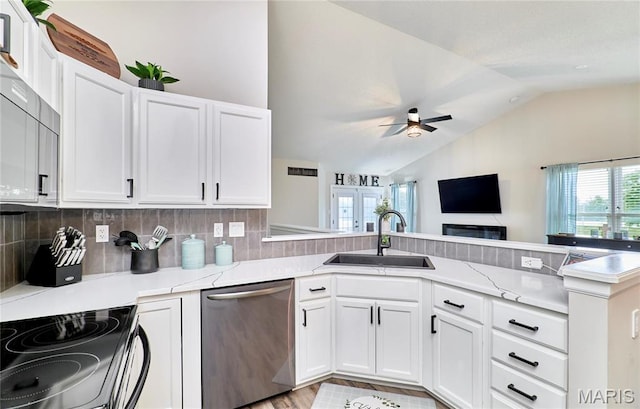 10 Warshire Ct Unit 67B, Ofallon, MO 63366 - kitchen featuring dishwasher, a sink, vaulted ceiling, a peninsula, and white cabinets