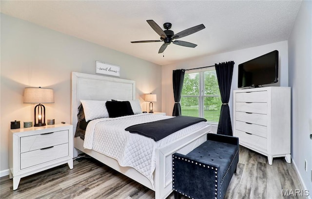10 Warshire Ct Unit 67B, Ofallon, MO 63366 - bedroom with wood finished floors, baseboards, and ceiling fan