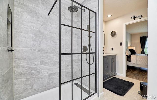 10 Warshire Ct Unit 67B, Ofallon, MO 63366 - ensuite bathroom with tiled shower, vanity, recessed lighting, and baseboards