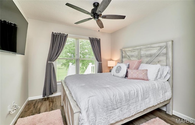 10 Warshire Ct Unit 67B, Ofallon, MO 63366 - bedroom with baseboards, wood finished floors, a ceiling fan, and a textured ceiling